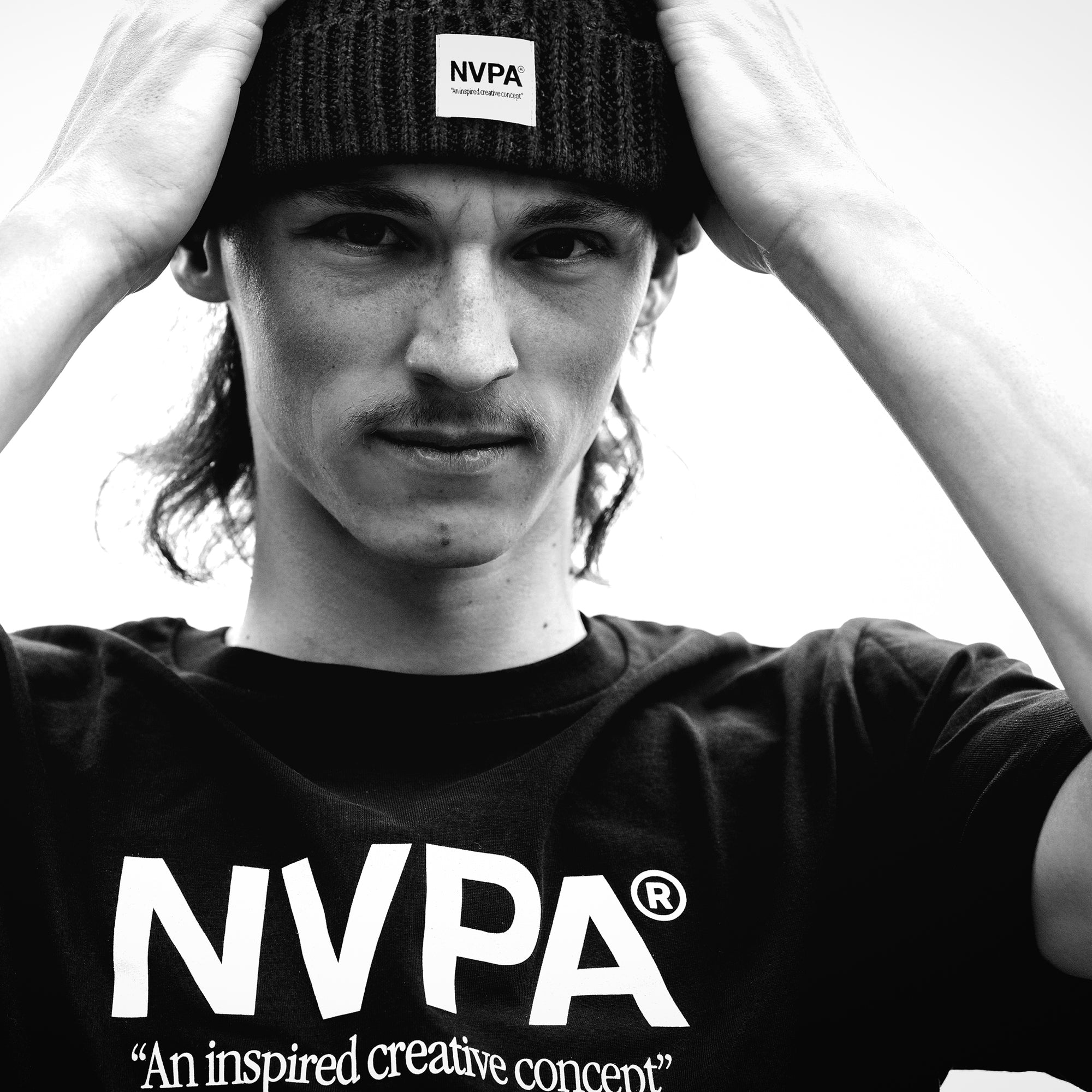Model wears NVPA® t-shirt and patch beanie